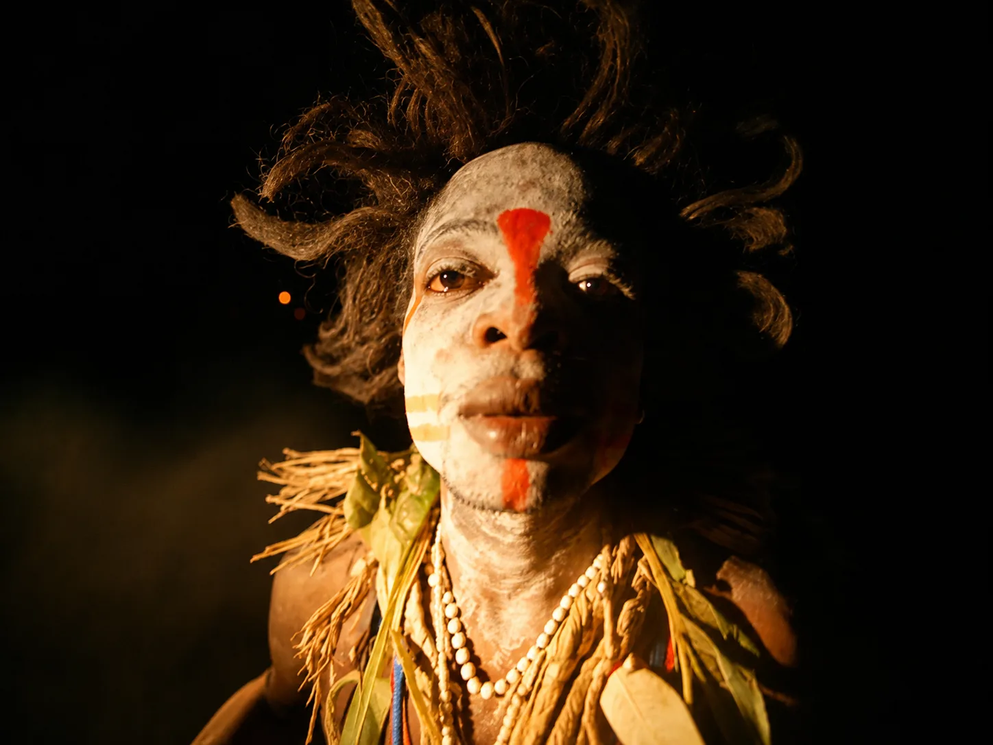Portrait of an initiate during the night ceremony — the rite of the sacred wood