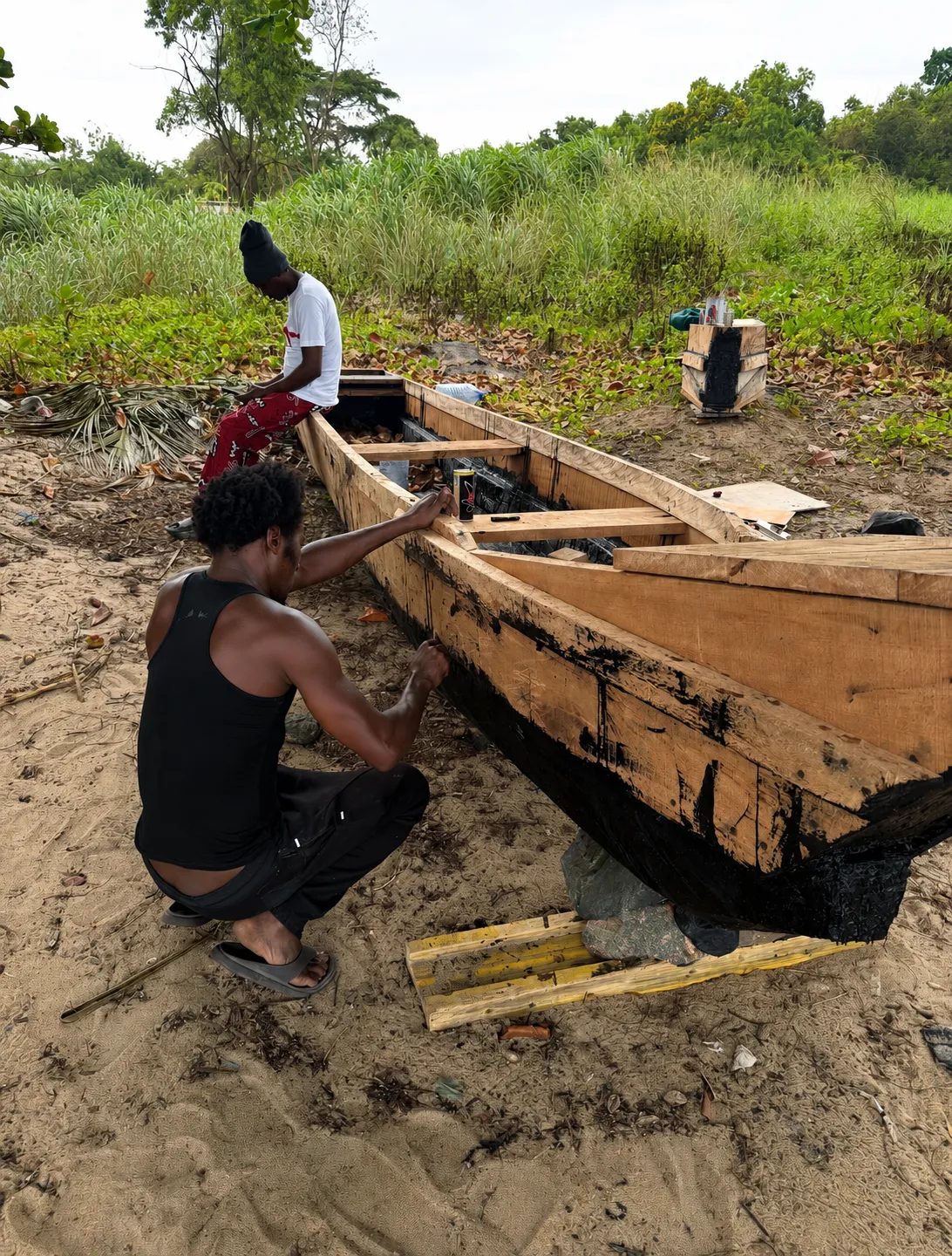 Building Mbilou's Bwiti pirogue on the beach, by the ocean — step 6